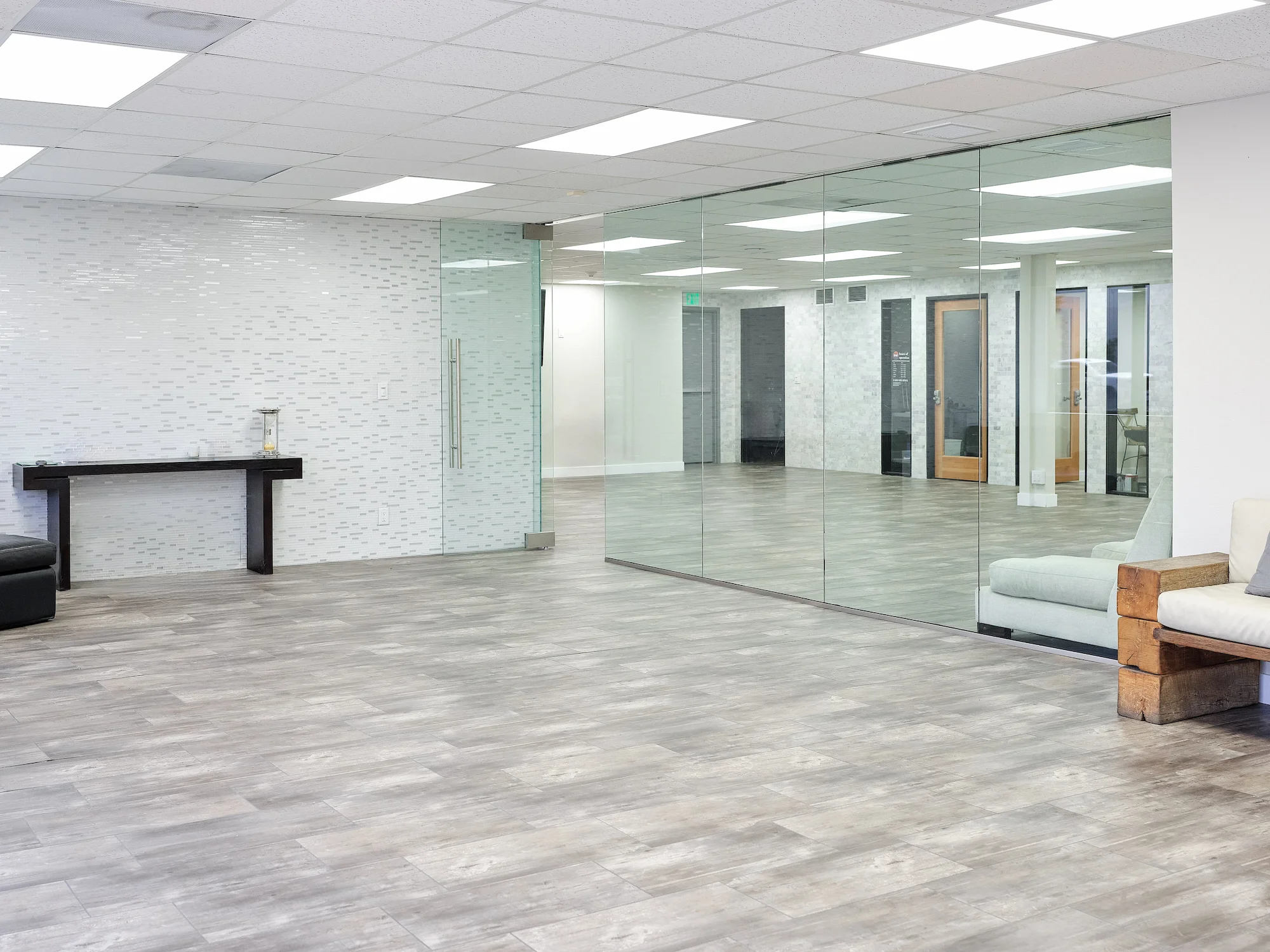 Empty office space and conference room interior with glass walls and doors